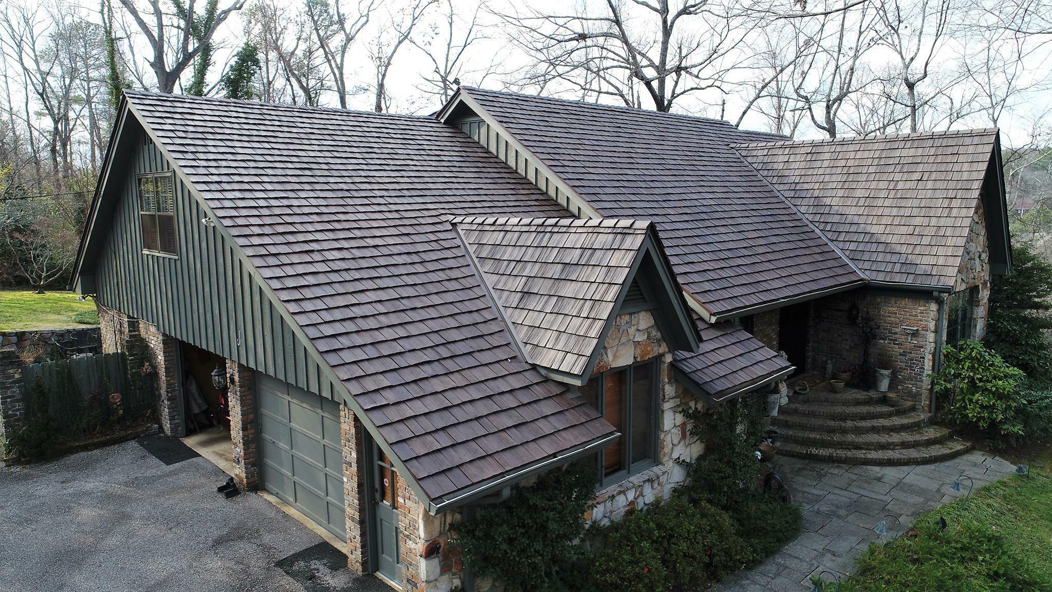 A new roof, installed by Roof Rite, sits atop a large home in the Rocky Mountains.
