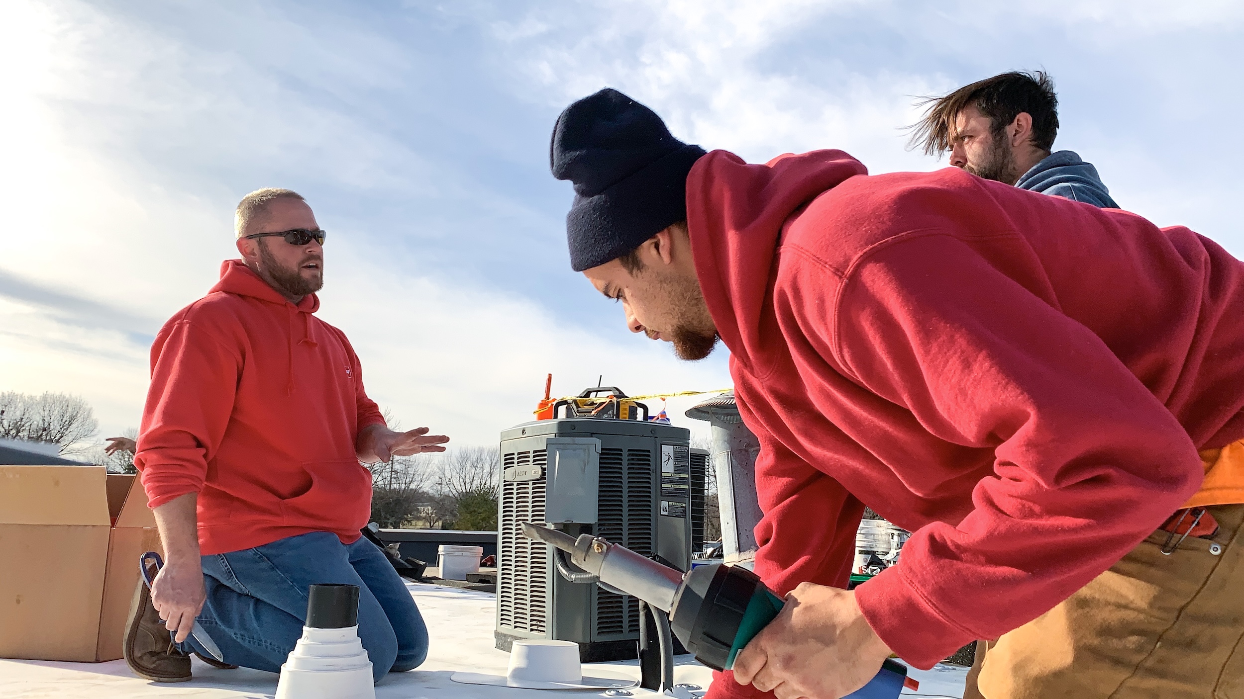 Our staff heat welding a roof